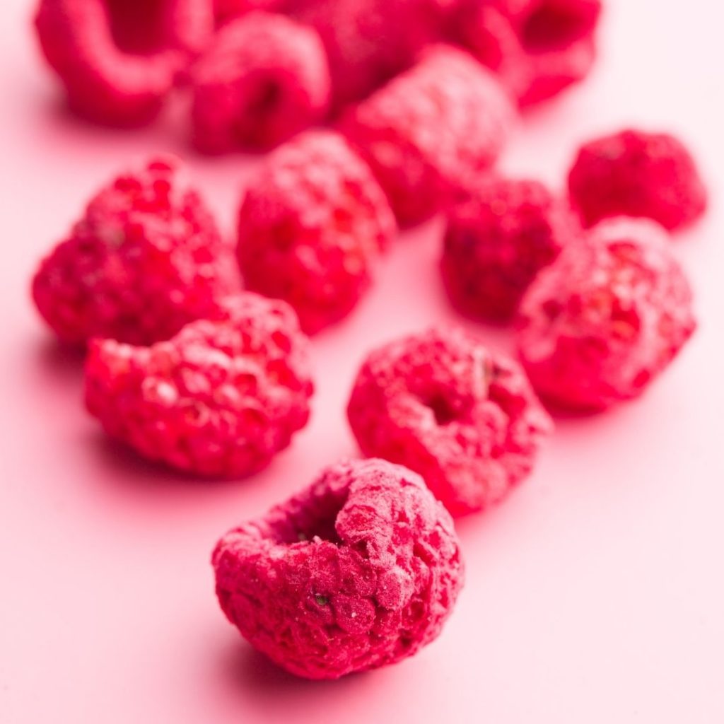 Freeze Dried Raspberries pink background